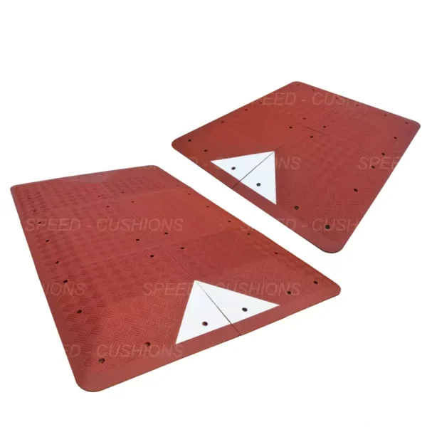 Two red and white speed cushions UK manufactured by the Speed Cushion Factory