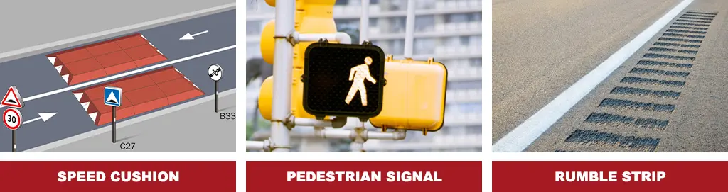 A pair of red speed cushions, a pedestrian signal, and rumble strips as traffic-calming devices.