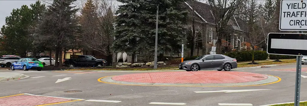 A red roundabout used as a traffic-calming tool.