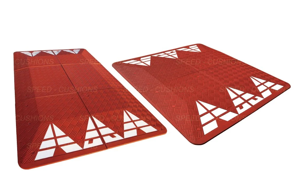 Red Europe speed cushions with white reflective films.